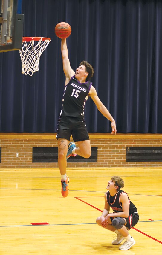 Litchfield's Tate Dobrinich got a little help from Nokomis' Mason Stauder during the slam dunk contest at the Carlinville Rotary Club All-Star Basketball Classic on March 24, as he hurdled the Redskin guard on one of his attempts. Dobrinich scored 47 out of a possible 50 points, winning the contest and completing a sweep for the Purple Panthers as A.J. Odle won the three-point shootout at the event.