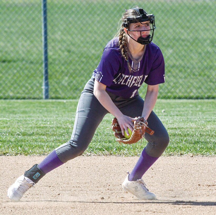 Litchfield-Mt. Olive infielder Alyssa Aubuschon scoops a grounder during the Panthers' game with Greenville on Friday, March 29. The hosts held the Comets to just three runs, but a stellar outing from Greenville's Kaitlyn Lurkins silenced Litchfield's bats and gave the visitors a 3-1 win.