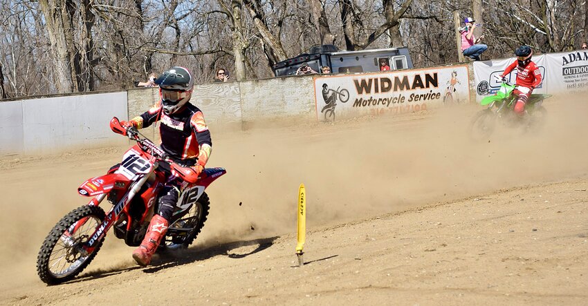 Gillespie's Collin Johnson kicks up some dust around one of the corners at the Belleville Enduro Team grounds on Feb. 25, during round one of the So. IL Off-Road Racing Series. Johnson went on to run eight laps in 2:10:24 to win the AA class and the overall top spot for the Big Bikes division.
