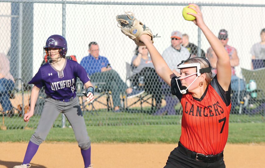 Litchfield&rsquo;s Bella Lueken watches from third base as Lincolnwood pitcher Taryn Clarke prepares to bring her delivery to the plate in the sixth inning of the game in Litchfield on Monday, April 8. Clarke only allowed two earned runs in the game, but Litchfield picked up a 5-1 win over the visitors from Montgomery County&rsquo;s panhandle.