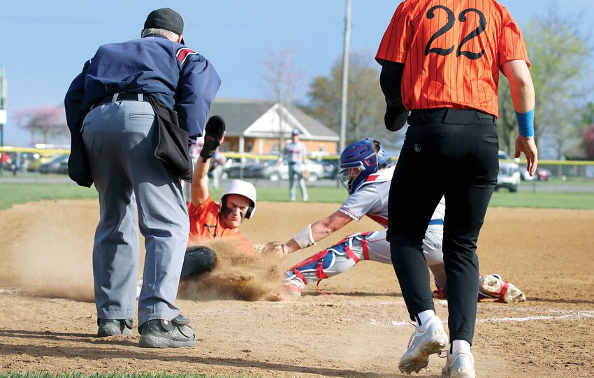 Lincolnwood&rsquo;s Brodey VanHooser slides into home just underneath the tag of Pawnee catcher Griffin Boblitt in the first inning of the MSM Conference showdown between the Lancers and Indians on Tuesday, April 9. The run cut the Indians&rsquo; lead to 3-2 at the time, but the visitors managed to knock off the Lancers 11-3 in Lincolnwood&rsquo;s conference opener.