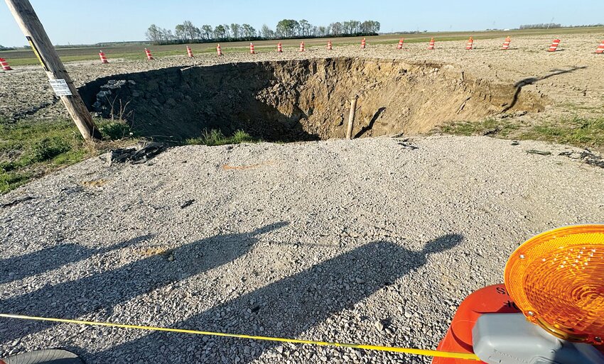 A 95-foot wide sinkhole in a field along Illinois Route 185 has indefinitely closed a portion of the road from Hillsboro to Coffeen in Montgomery County. The sinkhole was first noticed on Thursday morning, April 11, and is being closely monitored by officials from Deer Run Mine, the Illinois Department of Transportation, the Illinois Department of Natural Resources and Montgomery County Emergency Management Association.