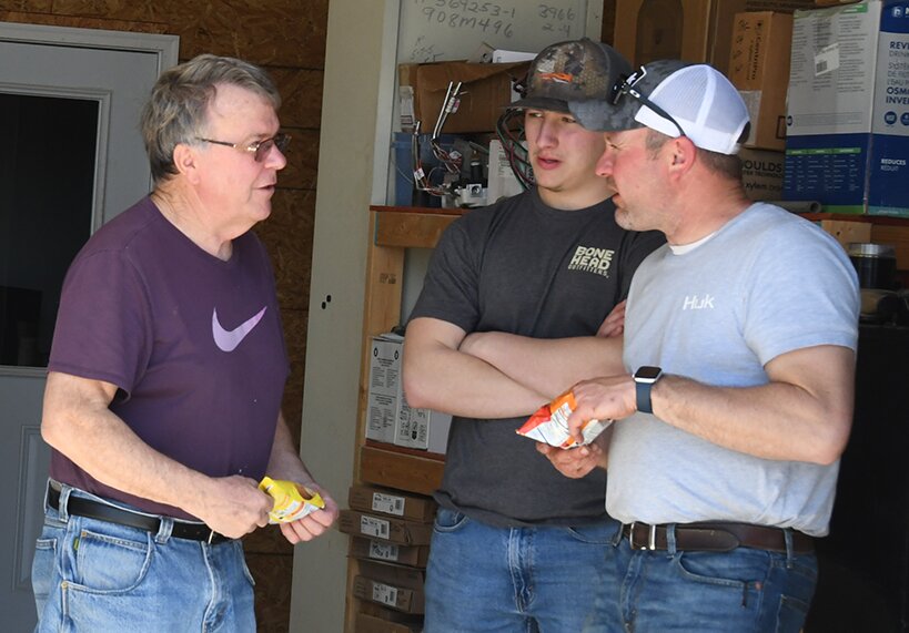 Pictured above, owner Dane Bondurant, at right, visits with customers at the open house.