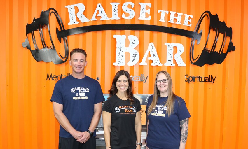 John Battuello and Melanie Irvine, pictured with Raise the Bar LLC owner Heather Greenwood (center), were the inaugural winners of the Hillsboro fitness center&rsquo;s 12 Week Transformation Challenge, which was held Jan. 8 through March 30. Battuello lost 13 pounds and gained 2.2 percent muscle, while Irvine lost 19.2 pounds and gained 1.9 percent muscle. All told, the nine people who participated in the challenge lost 77.4 pounds.