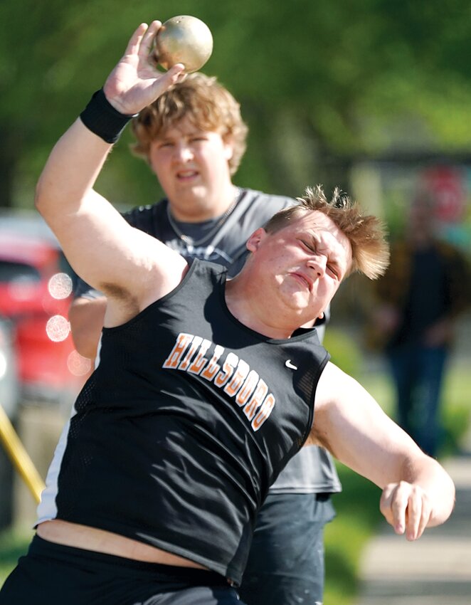 Hillsboro senior Cole Lenczycki uncorks a throw during the Greenville Relays on Friday, April 19. Lenczycki and teammate Austin Newingham finished third in the shot put at the 40th annual event, with the Toppers also finishing third as a team.