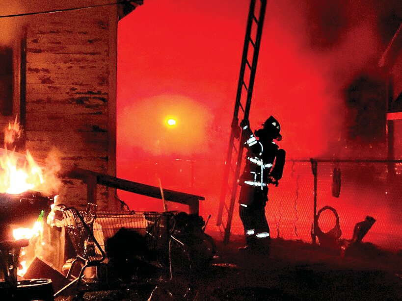 A Litchfield residence went up in flames in the early hours of Monday, April 29. Pictured above, one of the many brave firefighters on scene prepares to climb to the roof in order to cut ventilation holes.