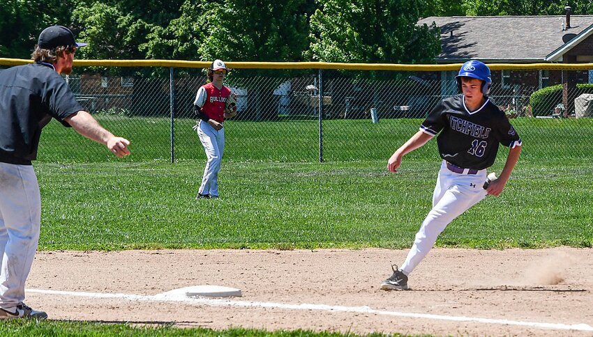 Litchfield Head Coach Rocky Giannuzzi gives Landon Wernsing the green light going around third as the Purple Panthers scored their seventh run of the game against Staunton on Saturday, May 11. The run was Litchfield's last in their 7-2 win over the Bulldogs that tied the program record for wins with 24.