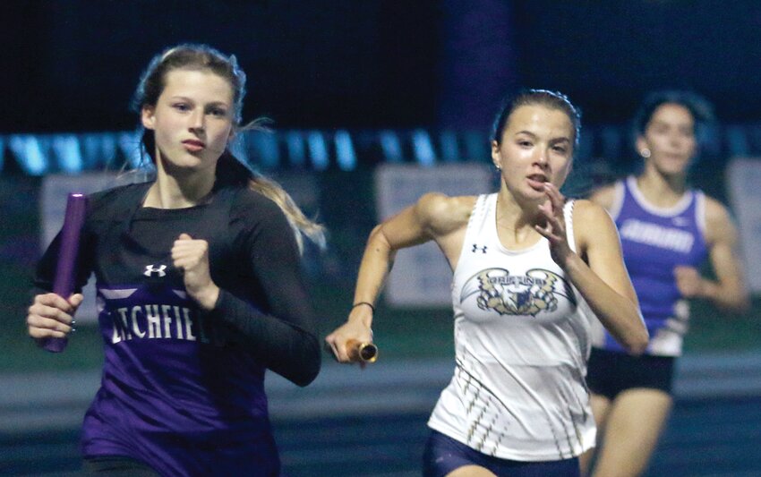 Litchfield's Izabella Fenton (left) and Father McGivney's Lilly Gilbertson were shoulder to shoulder going around the second turn on the opening leg of the 4x400, the final race of the day at the Class 1A North Mac Sectional on May 9. Gilbertson's Griffins would finish first in the 1600 meter race, with Fenton and teammates Gracie Boden, Brooke Braasch and Kendall Stewart coming in second to earn on of Litchfield's six state qualifying berths in Virden.
