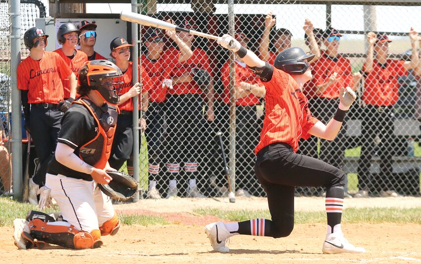 Lincolnwood's Lance Weitekamp goes down to get a pitch during the Lancers' 5-3 loss to Greenfield-Northwestern on Saturday, May 18, in Raymond. In his final game in orange and black, Weitekamp went 2-for-4, driving in two runs and scoring the third.