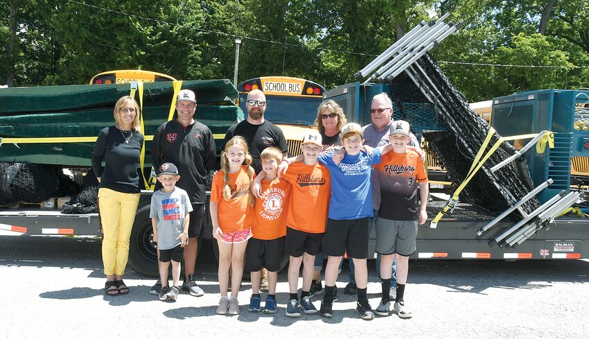 Pictured above, in front, from the left are Brady McBrain and the Redmans&rsquo; grandchildren, Oaklyn Spratt, Merritt Connor, Gunner Spratt, Vincent Connor and Garret Spratt. In back are Hillsboro High School Principal Patti Heyen, HHS head baseball coach Kyle McBrain, Action Powersports Operations Manager Nic Hahn and donors Nancy and Bruce Redman.