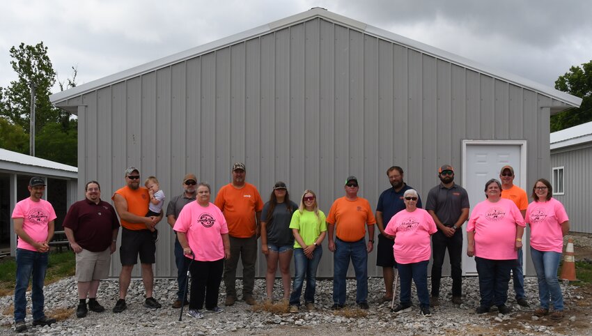 More than 40 volunteers from Hillsboro Laborers Union Local 1084, lent a hand to the Montgomery County Fair Board, recently as they constructed a new building on the fairgrounds in Butler. From the left are James Elam, Kevin Brink, Andy Adams, Hudson Adams, Mike Young, LeEllen Watson, Rowdy Luck, Maggie Poynter, Madyson Austin, Kelly Matthews, Dustin Anderson, Marti Benning, Trevor Lohman, Bev Seamon, Matthew Blankenship and Bettina Lentz. Tommy Sherman and Randy Zebrauskas from Carpenters Local 270,  also lent a hand in the project. The new building will be mainly used for storage for items currently in the arts and crafts building. The fair board hopes to be able to rent out the arts and crafts building in the future for small events.