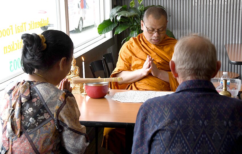 A Buddhist monk from the Wat Phrasriratanaram temple in Florrisant, MO, offered a traditional blessing for a new Thai restaurant in Nokomis, owned and operated by Bernie and Koonvadee Huber, pictured above. The blessing was held on Saturday, June 29, and the restaurant officially opens on Monday, July 1.