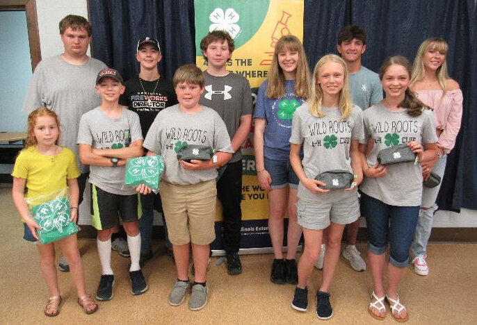 Local 4-H members were honored on Tuesday evening, June 25, at the University of Illinois Extension office in Hillsboro for their general show projects. Pictured above are some of the Best of Show award winners. In front, from the left are Anna Mulch, Caleb Mulch, Jase Cooper, Abigail Monk and Emily Monk. In back are Travis Broers, Landon Hilgendorf, Kohen Stolte, Amanda Niemann, Bond Knodle and Lauryn Miller.