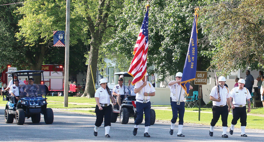 As tradition dictates, members of the American Legion presented the colors to lead off the Raymond Celebration parade on Saturday, Aug. 3.