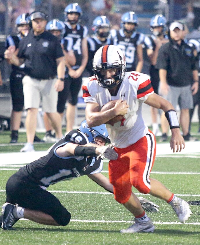 Hillsboro's Elias Baney (#24) attracted plenty of attention, whenever he field a kickoff during the Toppers' season opener against North Mac in Virden on Aug. 31. The speedy Panthers held Loskot to 11 yards on two returns and kept the Topper offense in check during a 34-6 victory on their home turf.