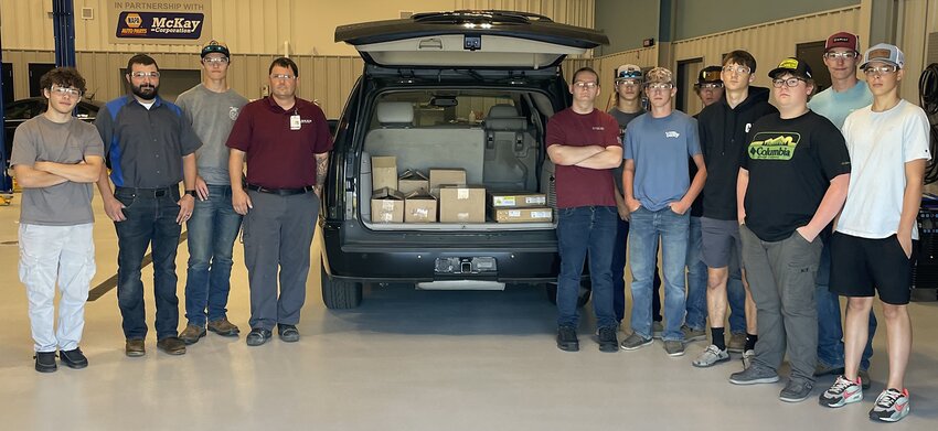 Ranken Technical College recently donated a gift of tools and equipment to the SCI Regional Workforce Training and Innovation Center in Litchfield. Pictured above, from the left, are instructor Eric Gray, Robert Callanan, automotive division chair of Ranken Technical College and a session of the SCI center&rsquo;s auto tech students. They are shown receiving a truckload of tools and equipment that are needed to proceed with the auto tech program&rsquo;s goal of ASE accreditation.