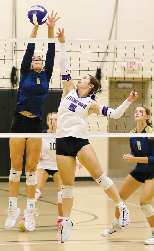 Litchfield's Avery Stewart tries to tip a shot over Father McGivney's Mia Lieberman during the fifth place match of the Grace Tournament on Saturday, Sept. 14, in Raymond. Liebermann, who made this year's all-tournament team, and the Griffins held on to beat the Panthers 25-16, 24-26, 15-13 in the match. More photos from the tournament can be found at masonlachance.smugmug.com.