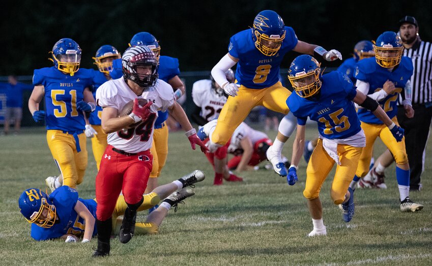 Nokomis running back Nolan Herpstreith leaves a trail of Blue Devils in his wake in the midst of a 77-yard run to the end zone on the Redskins' second offensive play of the game in Villa Grove on Friday, Sept. 13. Herpstreith finished the game with 12 carries for 190 yards and two scores as the Redskins defeated Villa Grove 62-13 to improve to 3-0.