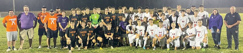 Members of the Lincolnwood and Hillsboro soccer teams take a group photo with the family of Grace Herschelman following the second annual Grace Cup game between the two rivals. After finishing in a tie last year, Hillsboro won this year&rsquo;s game by a 4-0 final score to take possession of the Grace Cup traveling trophy.
