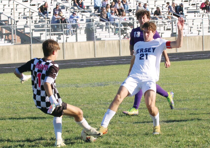 Litchfield goalkeeper Cooper Martin comes out of the box to prevent Jerseyville's Dax Goetten (#21) from a scoring opportunity in the first half of the Panther versus Panther regional semifinal in Litchfield. Martin and the Litchfield defense, including Braden Alexander (#13) kept it a 0-0 game at halftime, allowing the Panther offense to find another gear in the second half for a 5-0 victory.