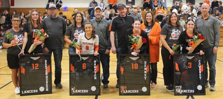 The Lincolnwood-Morrisonville volleyball team honored four of its own on Thursday, Oct. 17, prior to the Lancers&rsquo; three-set win over Springfield Lutheran. From the left are Jazmin Seaton-Hobson, with parents Amanda and Travis Hobson; Morgan Hampton, with parents Cassandra and Phil Hampton; Kierstyn Denney, with parents Zach and Kimberly Denney; and Morgan Cowdrey, with parents, Lesley and Scott Cowdrey.