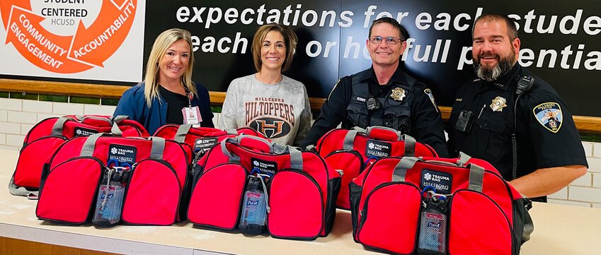 Pictured above, from the left are Hillsboro Health Director of Emergency Services Heather Lessman, HHS school nurse Bobbi Adams, School Resource Officer Frank Kenny and Police Chief Randy Leetham.