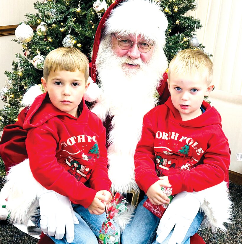 As is tradition during the most wonderful time of the year, Santa was in town at Bank and Trust in Raymond on Saturday. He's pictured above with Weston and Stockton Brown at Bank &amp; Trust.
