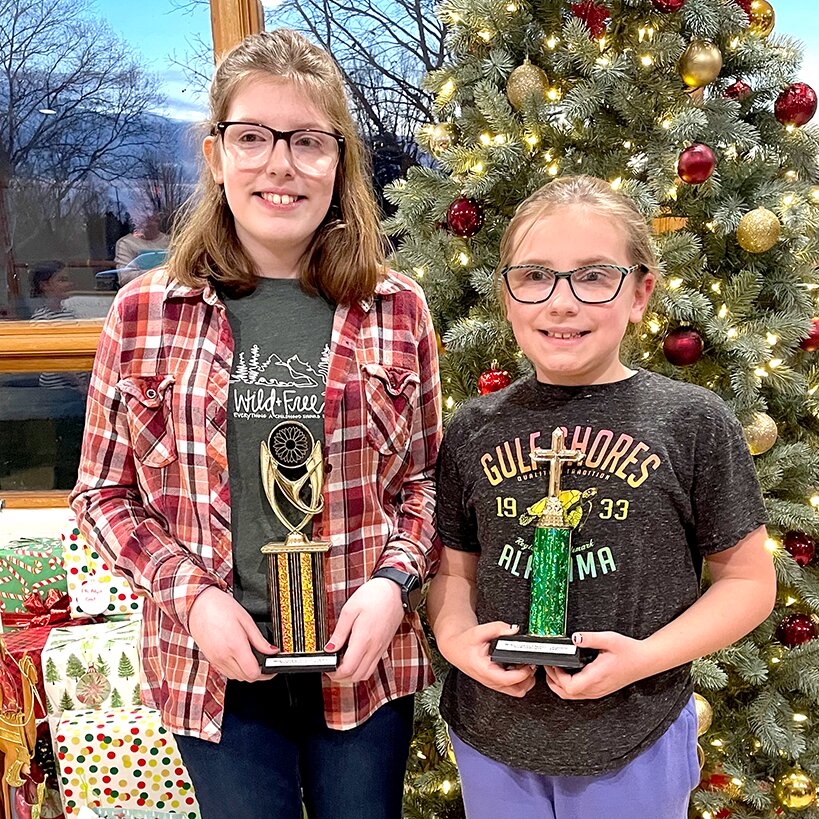 Two members of the Calvary Baptist Bible Quiz team made the trip up north to Janesville, WI, on Saturday, Dec. 7, and came home with hardware. Pictured above are Charlotte and Katie Plummer with their first place individual trophies.