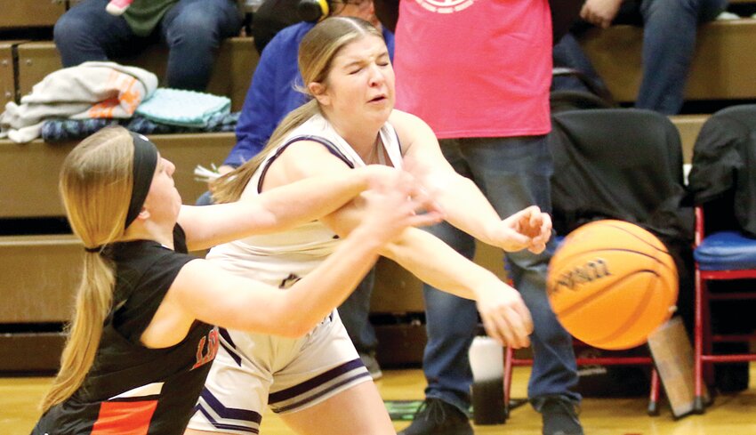 Lincolnwood's Leah Anderson (left) fouls Litchfield's Lynzie Reid in an attempt to get the ball away from the Panther freshman during the opening game of the T. Todt Shootout on Saturday, Dec. 14, in Carlinville. Reid had 11 points in the Lady Panthers' 40-34 win over the Lancers at the event held in honor of the late Terry Todt, who died in 2019 after battling cancer. Proceeds from the tournament benefitted the Montgomery County Cancer Association in Todt's memory.