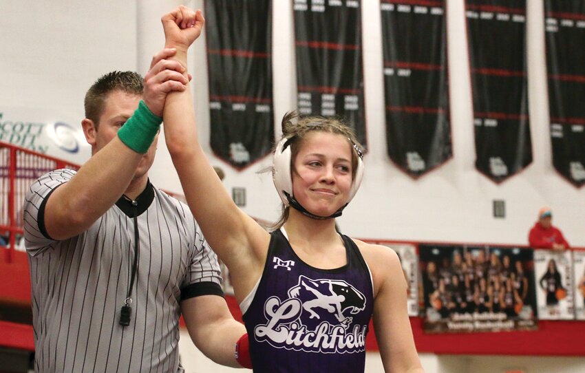 Litchfield sophomore Rilynn Younker has her hand raised after defeating Jala Singleton of Belleville West in the championship match of the 110-pound weight class at the Highland Sectional on Saturday, Feb. 15. The win moved Younker on to the IHSA Girls Wrestling State Tournament, which will be held in Bloomington on Feb. 28 and March 1.