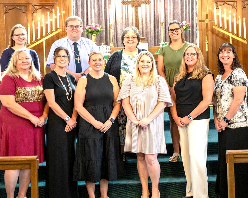 Pictured above in the front row are, Ali Melton (before/after school, pre-K plus, pre-K 3 aide), Aly Yates (before/after school, pre-K plus), Lisa Sharp (kindergarten), Ann Helgen (fourth grade), Mindy Fischer (third grade), Katie Gulley (first grade/athletic director.) In the back row are Eva Aiello (second grade/part-time deaconess), Jacob Mikkelson (seventh and eighth grade/choir), Jami Pryor (principal and fifth and sixth grade) and Erika Fortner (pre-K.)
