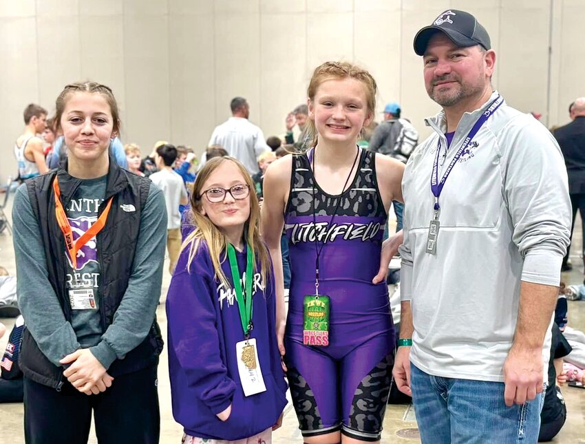 Litchfield's Ariah Moore and Penellope Cox both made the podium at the IKWF State Championships, which wrapped up on Saturday, March 8, in Peoria. From the left are Coach Rilynn Younker, Moore, Cox and Coach Shawn Hemken.