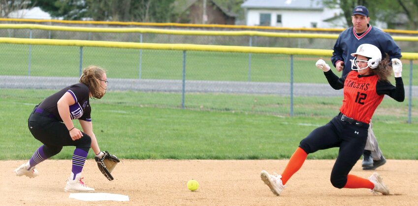 With Litchfield/Mt. Olive catcher Marissa Bono&rsquo;s throw from the plate to her sister, shortstop Charlie Bono, passing in front of her, Lincolnwood&rsquo;s Morgan Cowdrey begins her slide into second with a stolen base in the first inning of the Lancers&rsquo; home game against the Purple Panthers. Cowdrey went 3-for-4 for the day, with two two-run singles in the Lancers&rsquo; ten-run fifth inning, which gave them a 10-0 no-hit victory over the visitors from Litchfield.