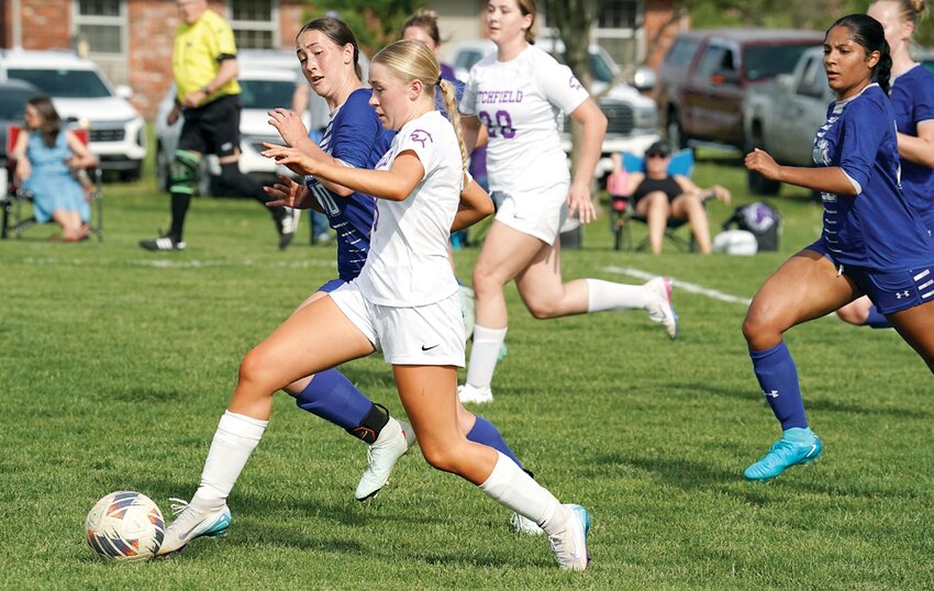 Litchfield's Chloe Law gains a step on the Greenville defense during the Lady Panthers' South Central Conference game in Bond County on Thursday, April 24. Law scored twice in the game and helped lead a frenetic attack on the Comet goal as Litchfield improved to 5-0 in the SCC with a 7-0 win.