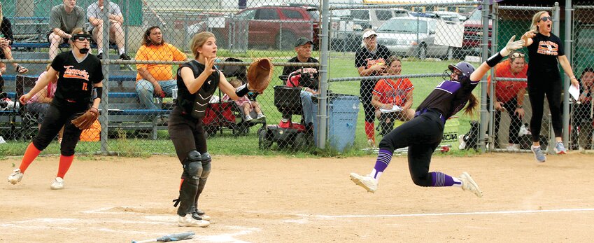 Litchfield-Mt. Olive's Chloe Green slides into home plate to score the game-tying run in the seventh inning of the Lady Panthers' regional game against Hillsboro on Monday, May 19. While the Panthers rallied from a two-run deficit in the seventh to send the game to extra innings, they weren't as fortunate in the extra frame as Hillsboro scored four times in the eighth and went on to win 10-6, advancing to the regional semifinal against Greenville, who they beat 4-3 on Tuesday, May 20.