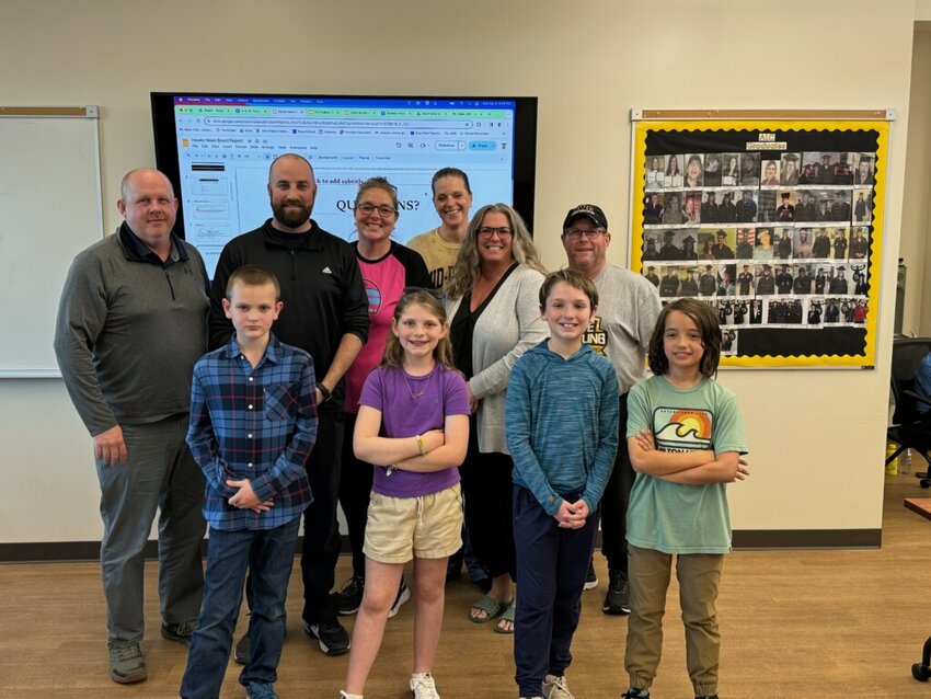 The student staff of West Elementary’s Hawks News presented to the school board on Monday night.  Back row, school board members Ryan Schlabaugh, Jed Seward, Gabrielle Frederick, Denise Chittick, Mary Allred, and Randy Billups.  Front row, the young journalists.