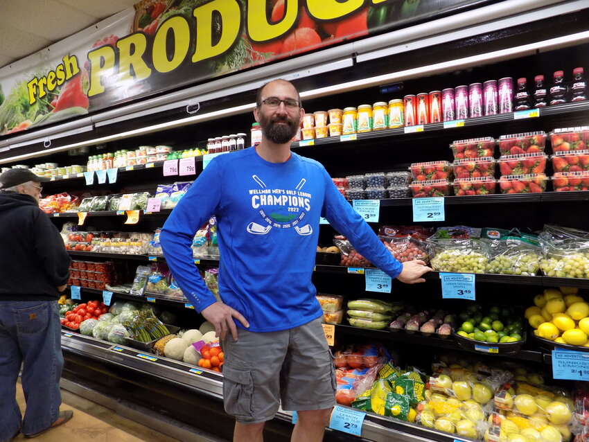 Clint Miller in front of Freeman Foods’ revamped produce section, where items are competitively priced and less common items such as plantains can be found.