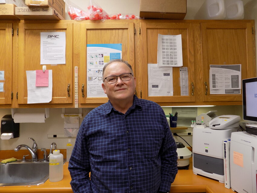 Dr. Sheldon Yoder, large animal veterinarian since 1977, inside the lab at Kalona Veterinary Clinic.