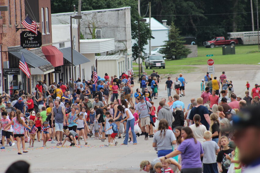 Like the grand finale of a fireworks show (which was cancelled in Wellman to protect the soggy golf course where the sparklers are launched), buckets of candy flooded the downtown street at the end of the parade.