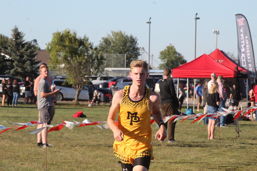 Emmett Swartzentruber of Mid-Prairie cruises toward the finish line for a season-opening win in the Williamsburg Raider Invitational on September 3.