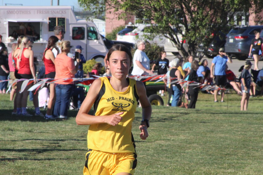 Mid-Prairie sophomore Brooklyn Stutzman cruises toward the finish line for a victory in the season-opening Williamsburg Raider Invitational.