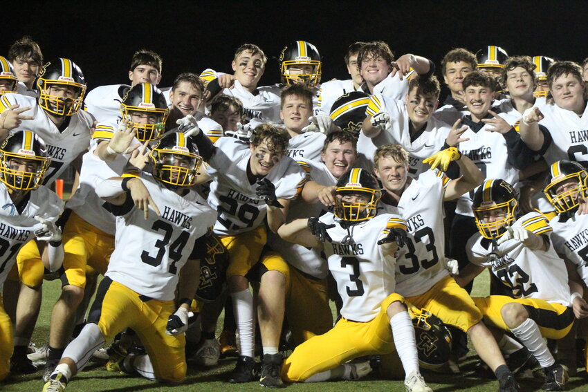 Mid-Prairie's football players celebrate their win at Mediapolis.