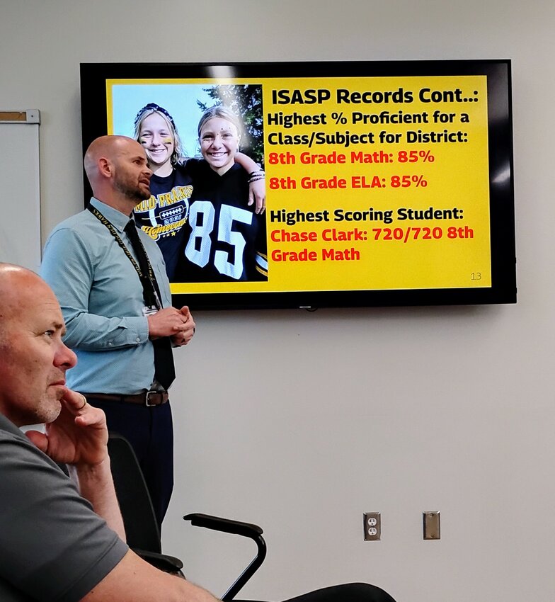 Mid-Prairie Middle School Principal Tim Bartels, standing, shared good news with the school board Monday, May 12.