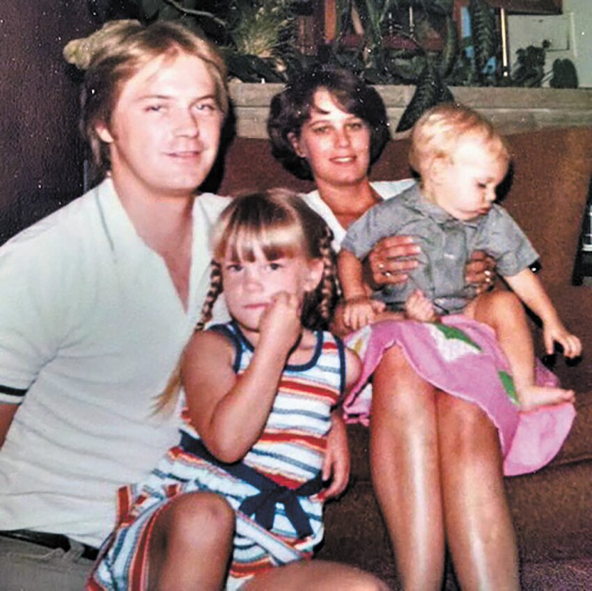 Dr. Olson (left) with his wife Cindy and their children Heather and Dustin.