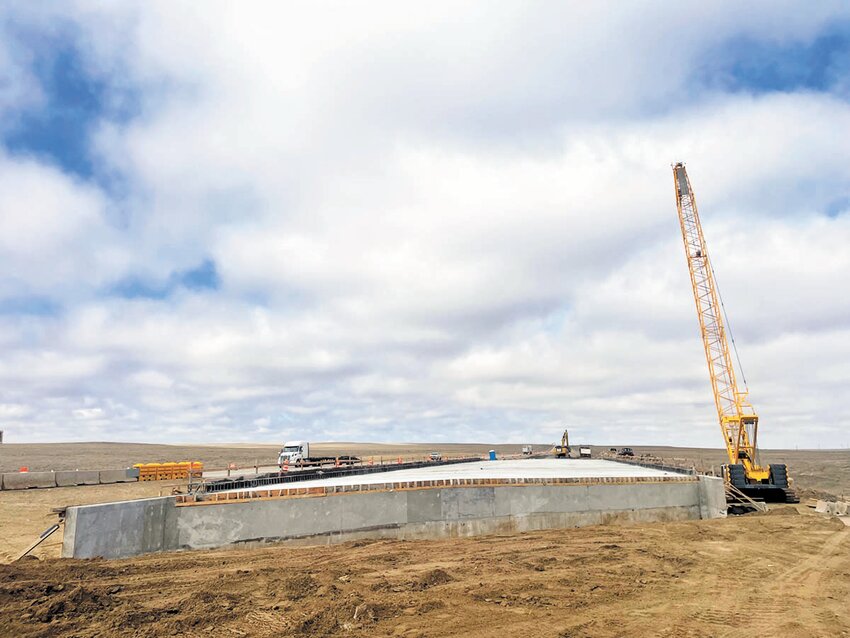 Crews will be backfilling the bridge and hauling in the road base to prepare for the upcoming road expansion.  Additionally, they will be pouring the deck bridge rail, which is essentially the bridge curb.