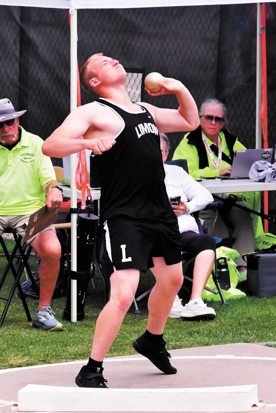 Kamden Kenny throws the shot put