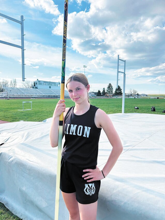 Emma Holferty tied the junior high girls league pole vault record at 7'6"