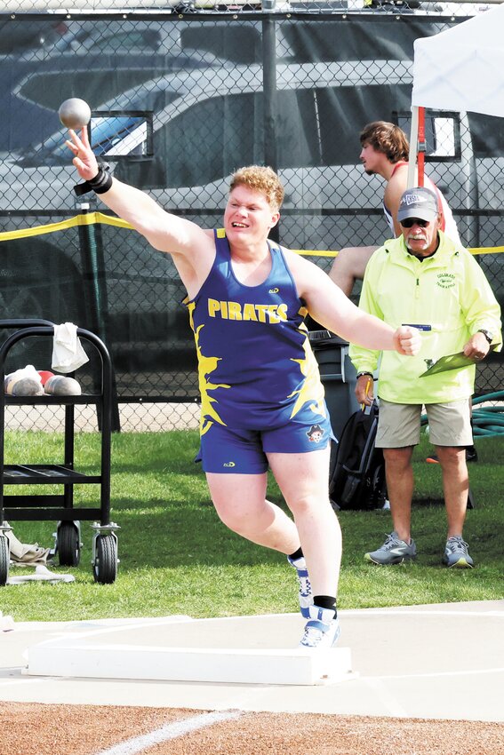 Spoke Carr competes in the shot put