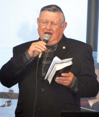Brother Bob Ingalls, lead organizer for the Easter Sunrise Service sponsored by the Denham Springs Kiwanis Club, participates in the singing.