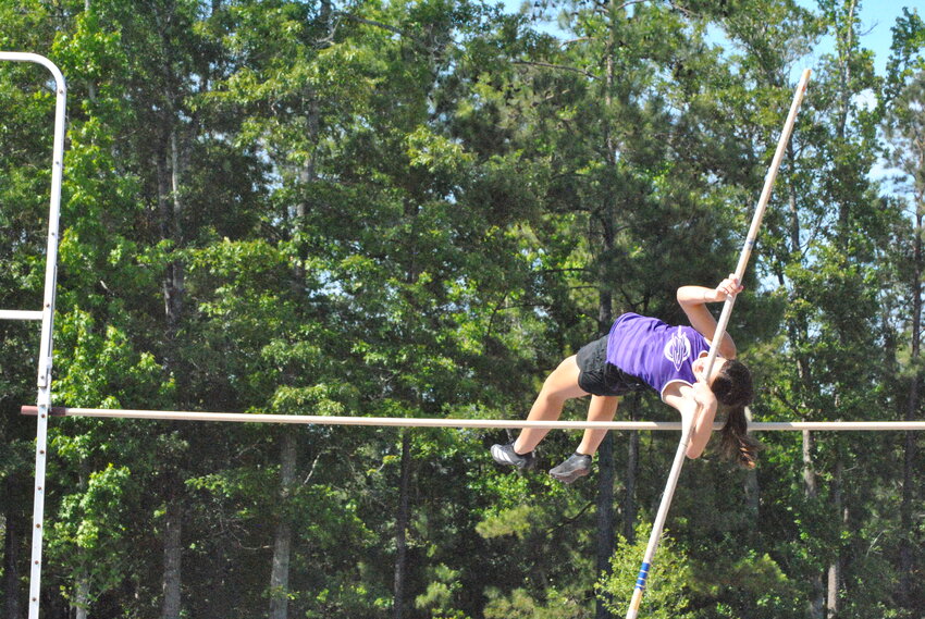 Holden's Blaize Foster attempts to clear the pole vault bar.